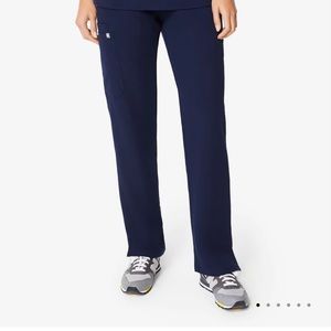 Brand new in unopened package. Navy blue “Kade” scrub pants size S.